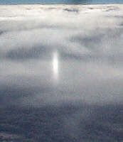 sun pillar glints in the ice crystals
 of the cold, high clouds